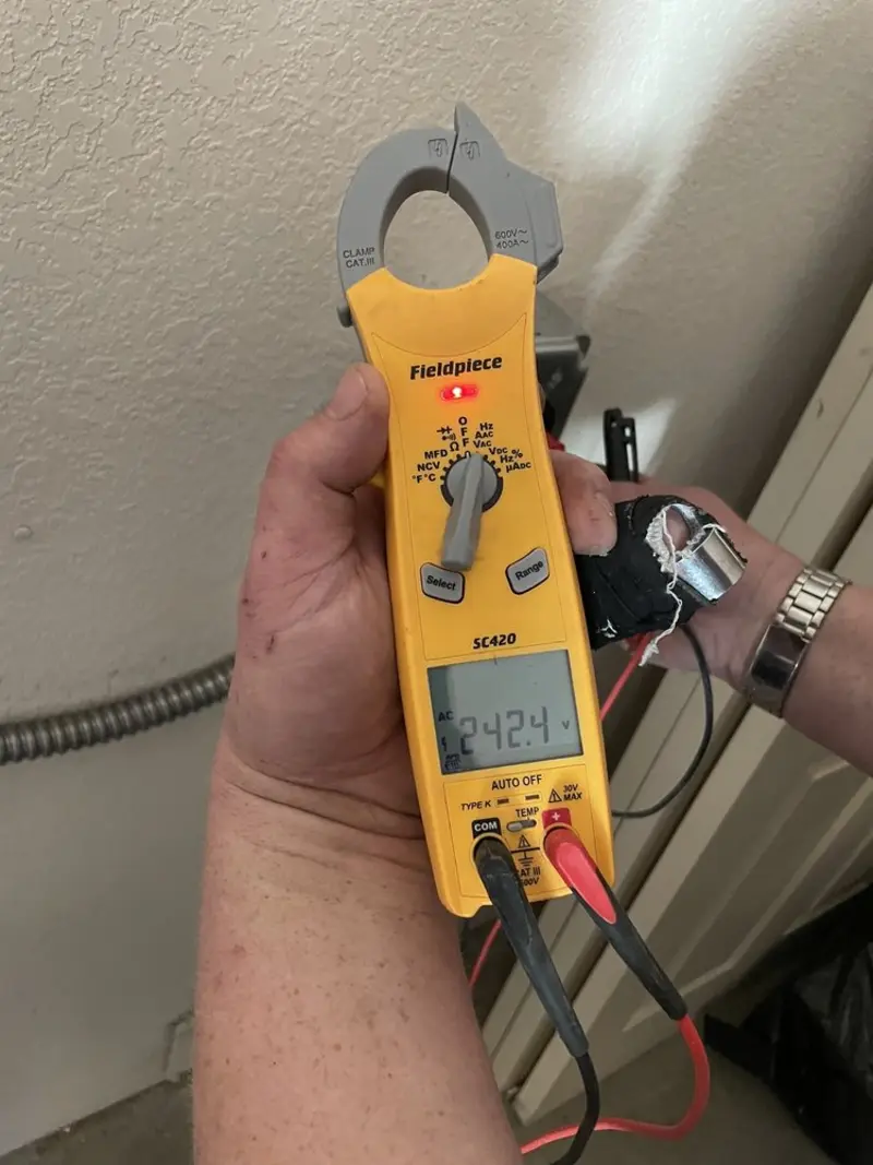 Voltage testing with clamp meter during Whole House Surge Protector in Medical Lake